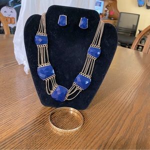 Necklace, earrings and bracelet.  Not branded
